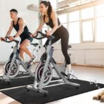 Woman walking on a walking pad treadmill while working from home