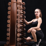 women strength training with dumbbells at home